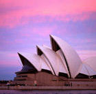 A view of Sydney Opera House at sunset, which can be visited via a cheap flight from Flight Centre.